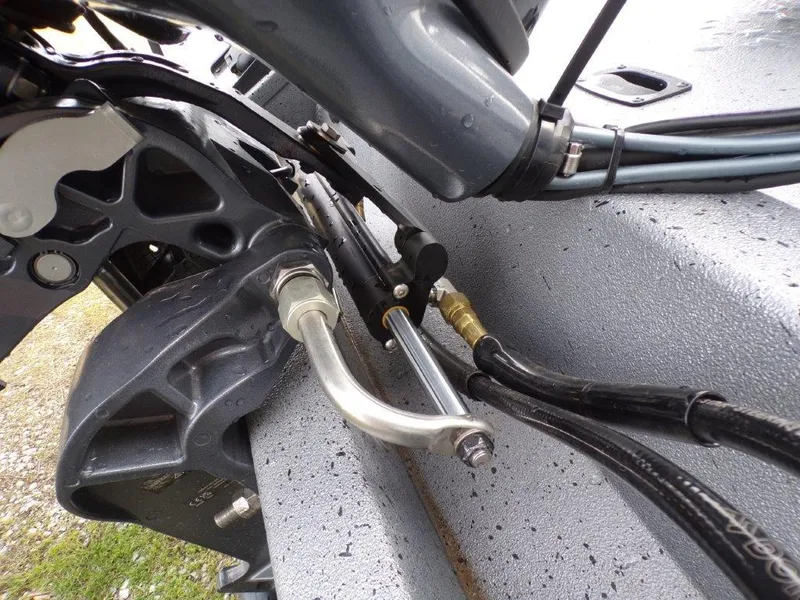 Slide: The Image of Close-up of 2025 Xpress H20BAY boat engine components and cables. - 2