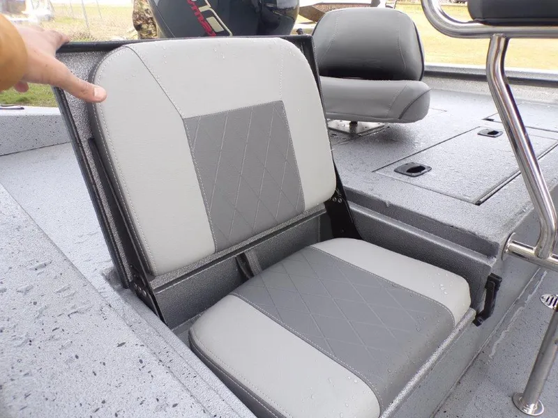 Slide: The Image of 2025 Xpress H20BAY boat seat with gray upholstery and storage compartment. - 8