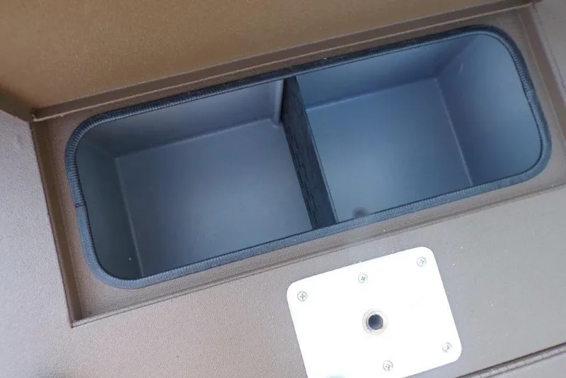 Slide: The Image of Open storage compartment in 2026 Xpress XP200 boat, featuring dual sections. - 15