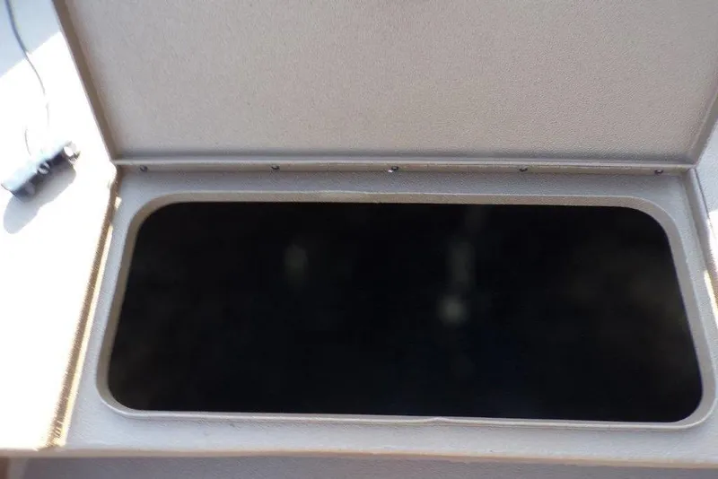 Slide: The Image of Open storage compartment in 2026 Xpress XP200 boat. - 16