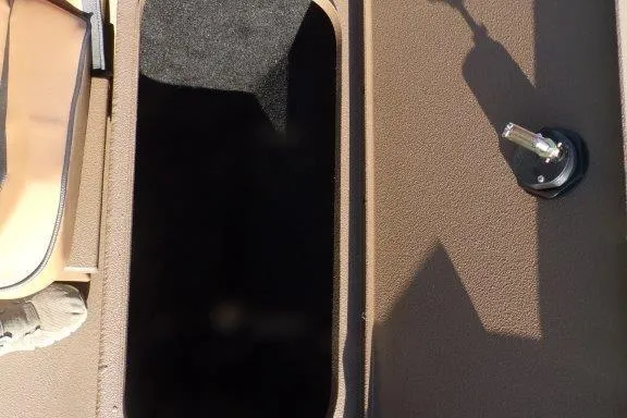 Slide: The Image of 2026 Xpress XP200 boat interior with storage compartment and seat detail. - 17