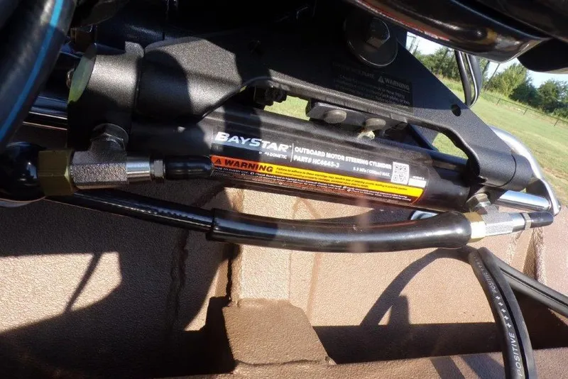 Slide: The Image of BayStar outboard motor steering cylinder on 2026 Xpress XP200 boat. - 2