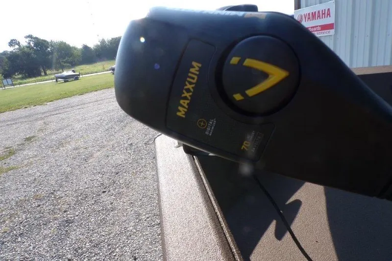 Slide: The Image of Close-up of a Maxxum motor on a 2026 Xpress XP200 boat, outdoor setting. - 20