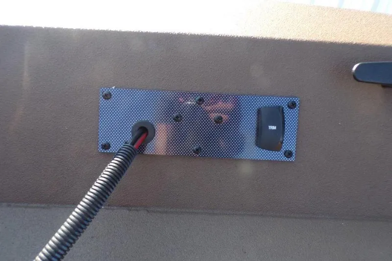 Slide: The Image of Control panel with trim switch on 2026 Xpress XP200 boat. - 21