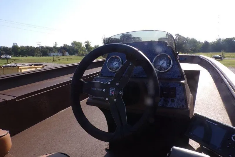 Slide: The Image of Steering console of 2026 Xpress XP200 boat with gauges and controls. - 4