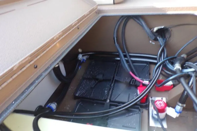 Slide: The Image of Battery compartment of 2026 Xpress XP200 boat with cables and connectors. - 6