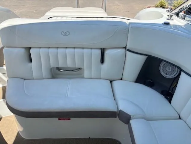 Slide: The Image of 2005 Cobalt 272 boat interior with white leather seating and built-in speaker. - 10