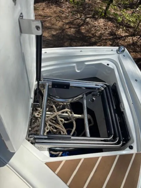 Slide: The Image of Open storage compartment on 2005 Cobalt 272 boat with ropes and ladder. - 12