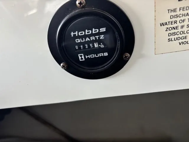 Slide: The Image of Hobbs Quartz hour meter on 2005 Cobalt 272 boat, displaying 735 hours. - 16