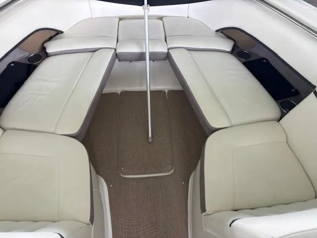 Slide: The Image of Interior seating of a 2005 Cobalt 272 boat, featuring beige upholstery. - 21