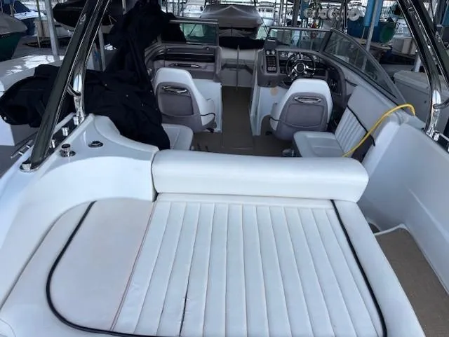 Slide: The Image of 2005 Cobalt 272 boat interior with white seating and steering console. - 8