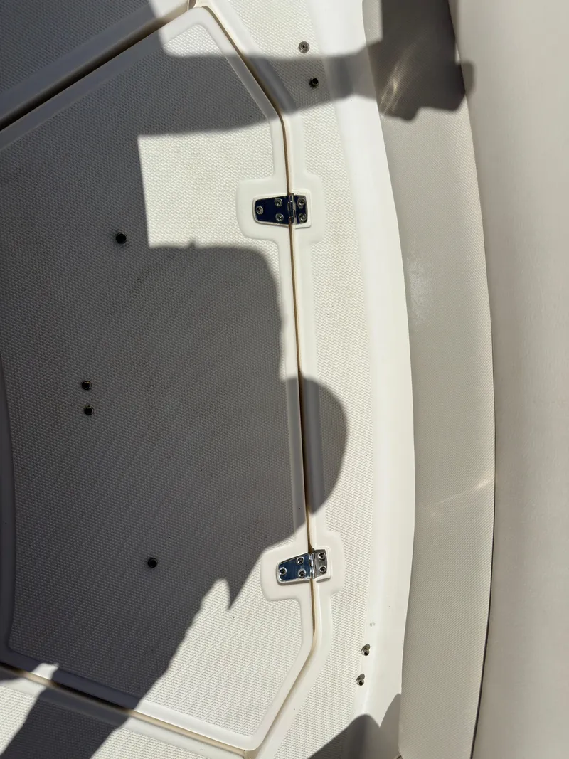 Slide: The Image of 2021 Boston Whaler Realm 380 boat deck with shadow and hinges. - 14