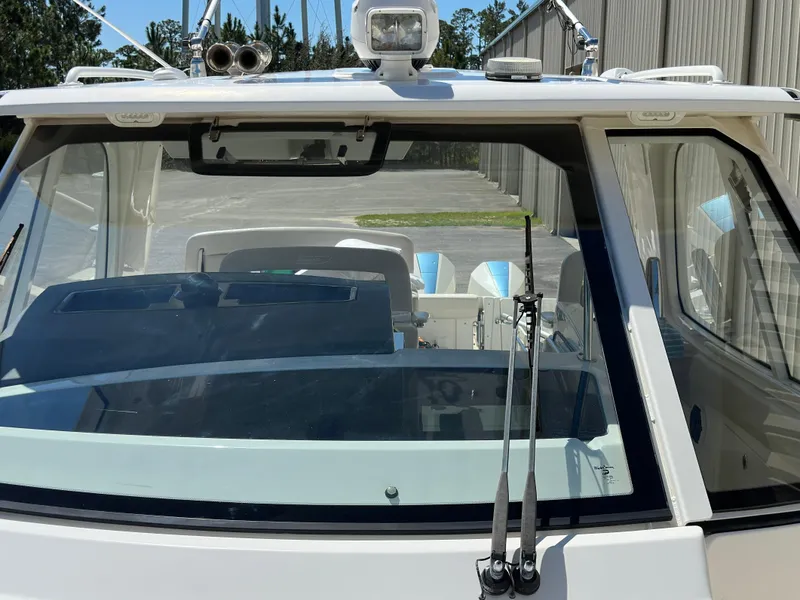Slide: The Image of 2021 Boston Whaler Realm 380 boat windshield and cockpit view. - 21