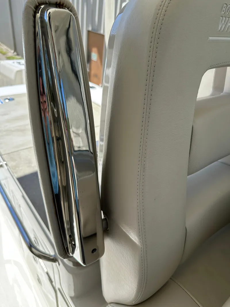 Slide: The Image of Close-up of 2021 Boston Whaler Realm 380 seat with chrome detailing. - 26