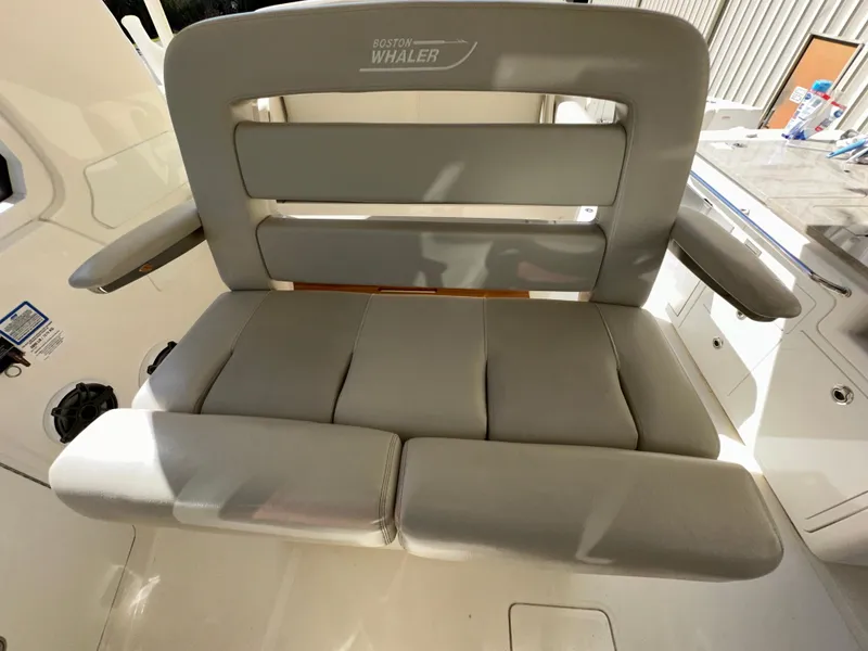 Slide: The Image of Boston Whaler Realm 380 2021 boat seat with cushioned backrest and armrests. - 36