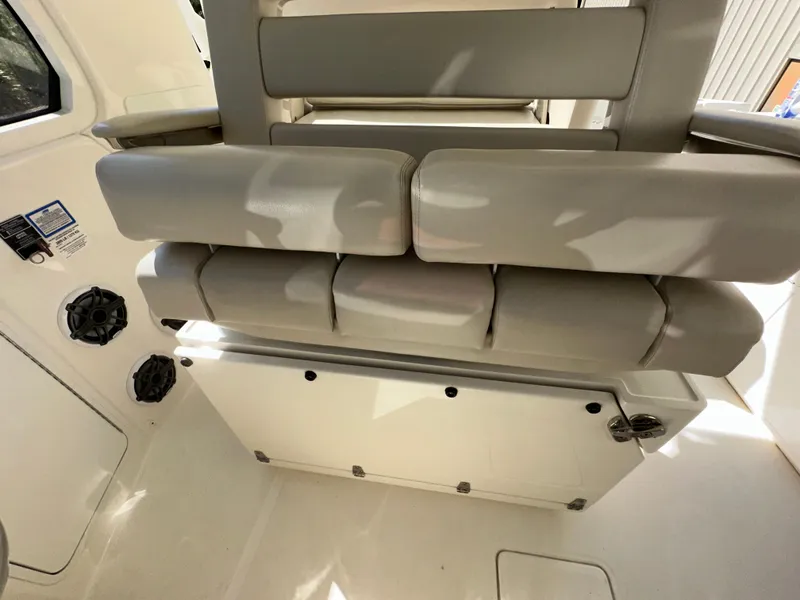 Slide: The Image of 2021 Boston Whaler Realm 380 interior seating, featuring cushioned seats and modern design. - 37