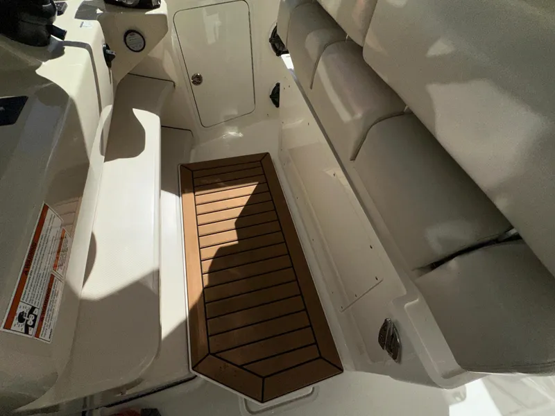 Slide: The Image of Interior view of 2021 Boston Whaler Realm 380 boat, featuring seating and wooden flooring. - 39