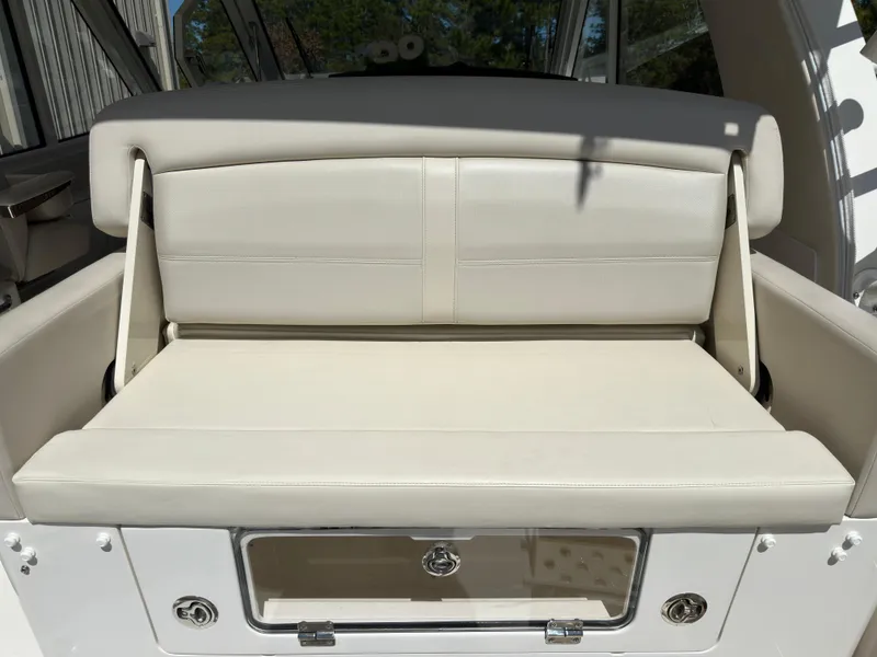 Slide: The Image of 2021 Boston Whaler Realm 380 boat seat, beige upholstery, rear view. - 40