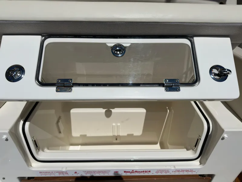 Slide: The Image of Open storage compartment on a 2021 Boston Whaler Realm 380 boat. - 42
