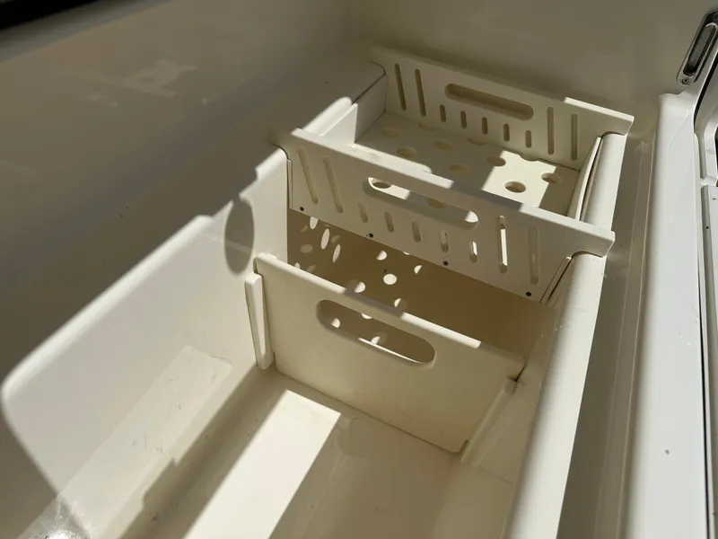 Slide: The Image of Storage compartments on a 2021 Boston Whaler Realm 380 boat. - 44