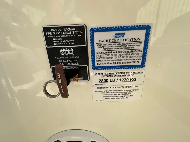 Slide: The Image of 2021 Boston Whaler Realm 380 yacht certification and fire suppression system labels. - 45