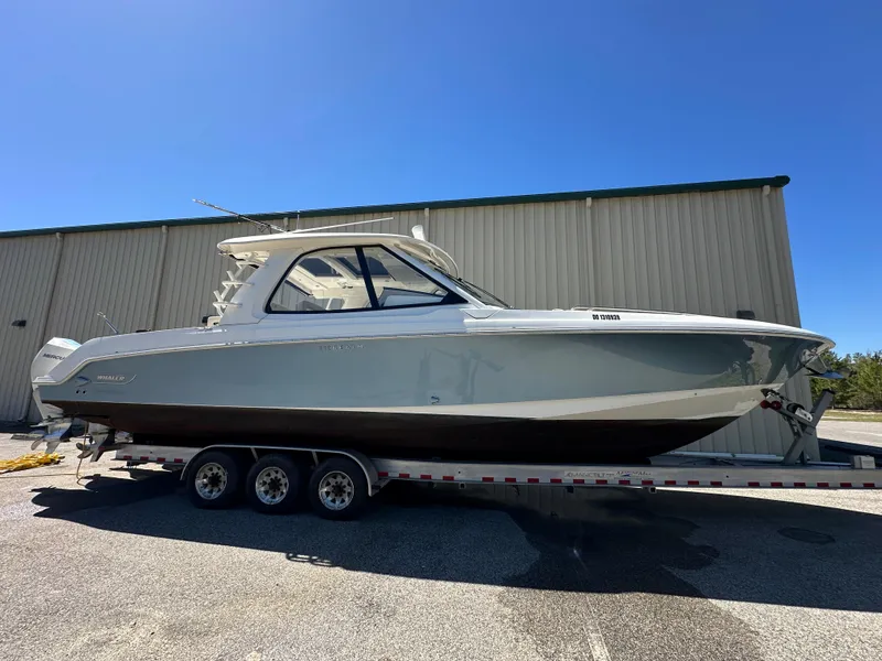 Slide: The Image of 2021 Boston Whaler Realm 380 boat on trailer, parked outdoors. - 5