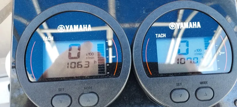 Slide: The Image of Yamaha tachometers on a 1990 Mako 261 Center Console boat dashboard. - 8