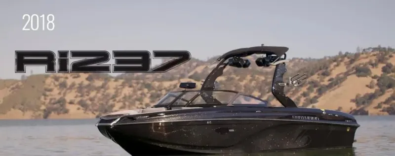 Slide: The Image of 2019 Centurion Ri237 boat on a lake with scenic background. - 1