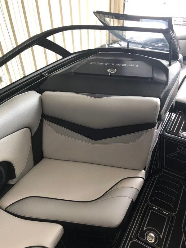 Slide: The Image of 2019 Centurion Ri237 boat interior with sleek seating and modern design. - 4
