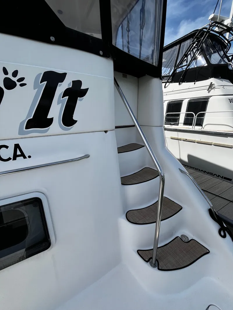Slide: The Image of 2001 Sea Ray 420 Aft Cabin yacht with exterior stairs and railing. - 10