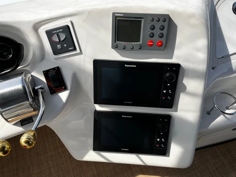 Slide: The Image of Control panel of 2001 Sea Ray 420 Aft Cabin with navigation equipment. - 19