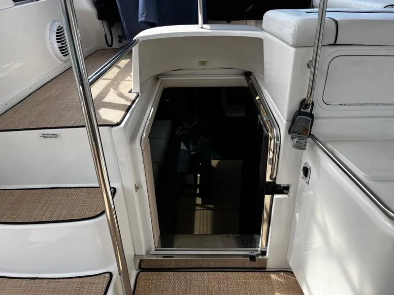 Slide: The Image of 2001 Sea Ray 420 Aft Cabin interior entrance with stairs and seating area. - 24
