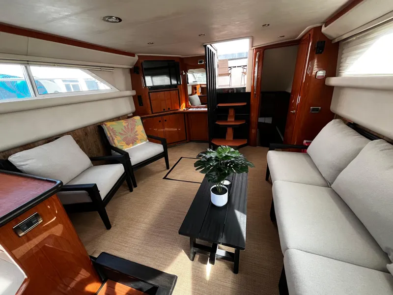 Slide: The Image of Interior of 2001 Sea Ray 420 Aft Cabin yacht with modern seating and decor. - 28