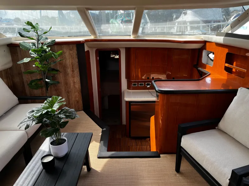 Slide: The Image of Luxurious interior of 2001 Sea Ray 420 Aft Cabin yacht with elegant seating and decor. - 31