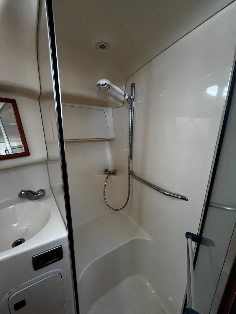 Slide: The Image of 2001 Sea Ray 420 Aft Cabin bathroom with shower and sink. - 38