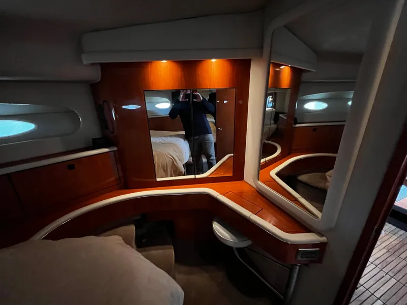 Slide: The Image of Interior of 2001 Sea Ray 420 Aft Cabin with wood accents and mirror. - 40