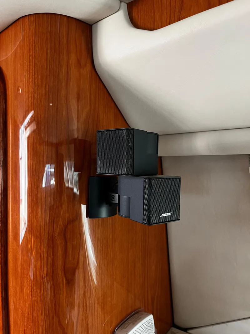 Slide: The Image of Bose speakers mounted on wood panel inside 2001 Sea Ray 420 Aft Cabin yacht. - 42