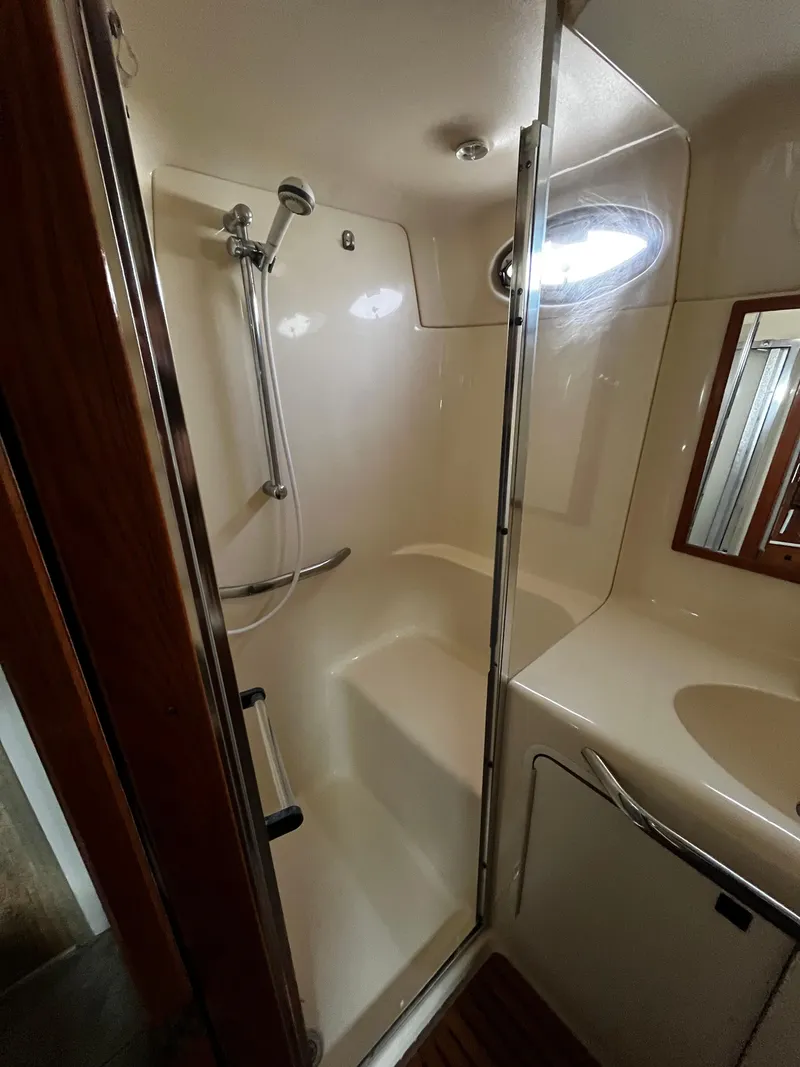 Slide: The Image of Shower area in 2001 Sea Ray 420 Aft Cabin yacht with sleek design and modern fixtures. - 44