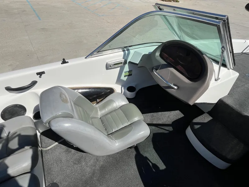 Slide: The Image of 2007 Triton 190 FS boat interior with steering wheel and seating. - 12