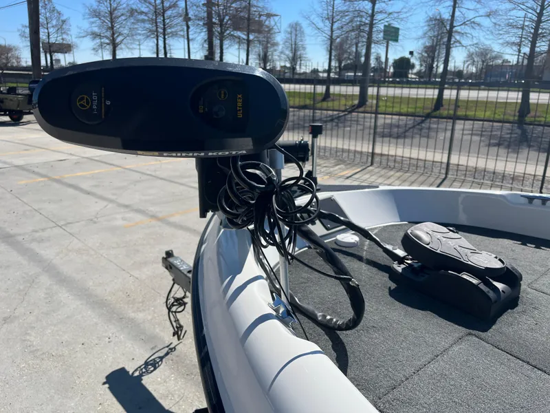 Slide: The Image of 2007 Triton 190 FS boat with trolling motor and foot pedal on deck. - 14