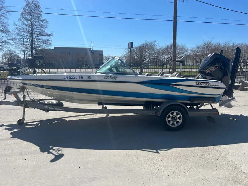 Slide: The Image of 2007 Triton 190 FS boat on trailer, parked outdoors in sunny weather. - 5