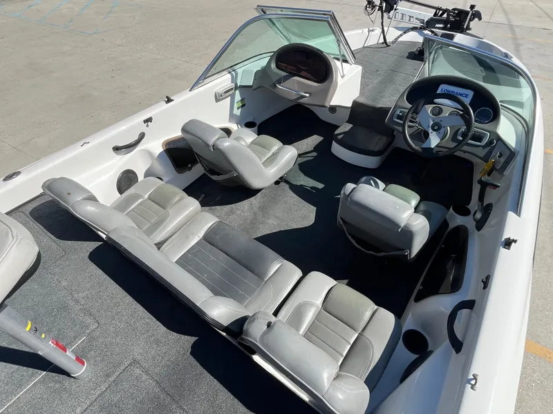 Slide: The Image of 2007 Triton 190 FS boat interior with seating and steering wheel, viewed from above. - 9