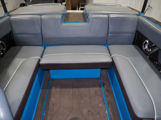 Slide: The Image of Interior of 2020 Malibu Wakesetter 22 MXZ with gray and blue seating. - 11