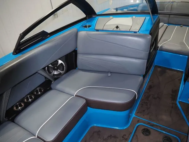 Slide: The Image of 2020 Malibu Wakesetter 22 MXZ interior with blue and gray seating. - 13