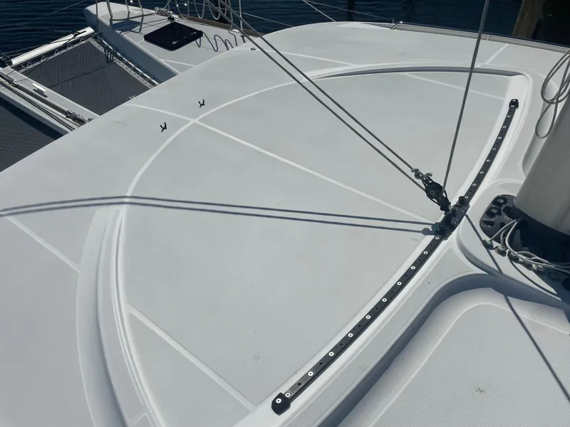 Slide: The Image of 2017 Lagoon 39 catamaran deck with rigging and netting, showcasing sleek design. - 11