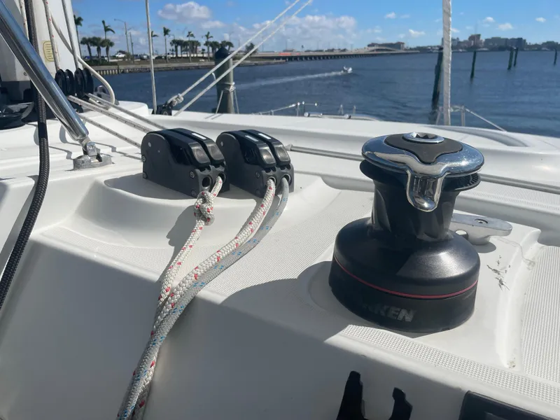 Slide: The Image of Close-up of 2017 Lagoon 39 sailboat deck with winch and ropes by the water. - 13