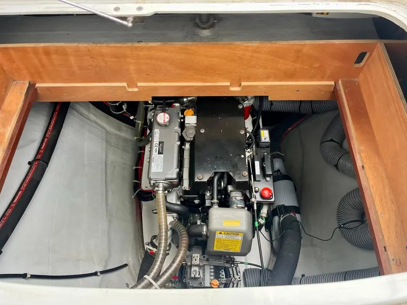 Slide: The Image of Engine compartment of a 2017 Lagoon 39 catamaran, showcasing mechanical components and hoses. - 25