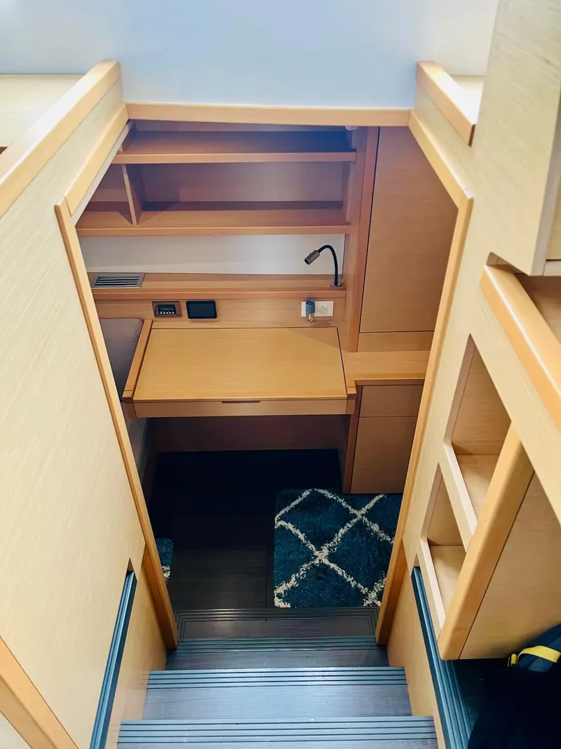 Slide: The Image of Interior of 2017 Lagoon 39 yacht with wooden cabinetry and compact workspace. - 33