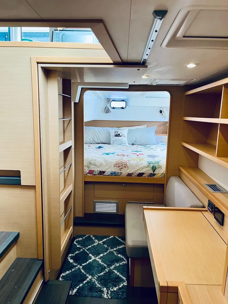 Slide: The Image of Interior of 2017 Lagoon 39 catamaran featuring cozy cabin with bed and wooden furnishings. - 35