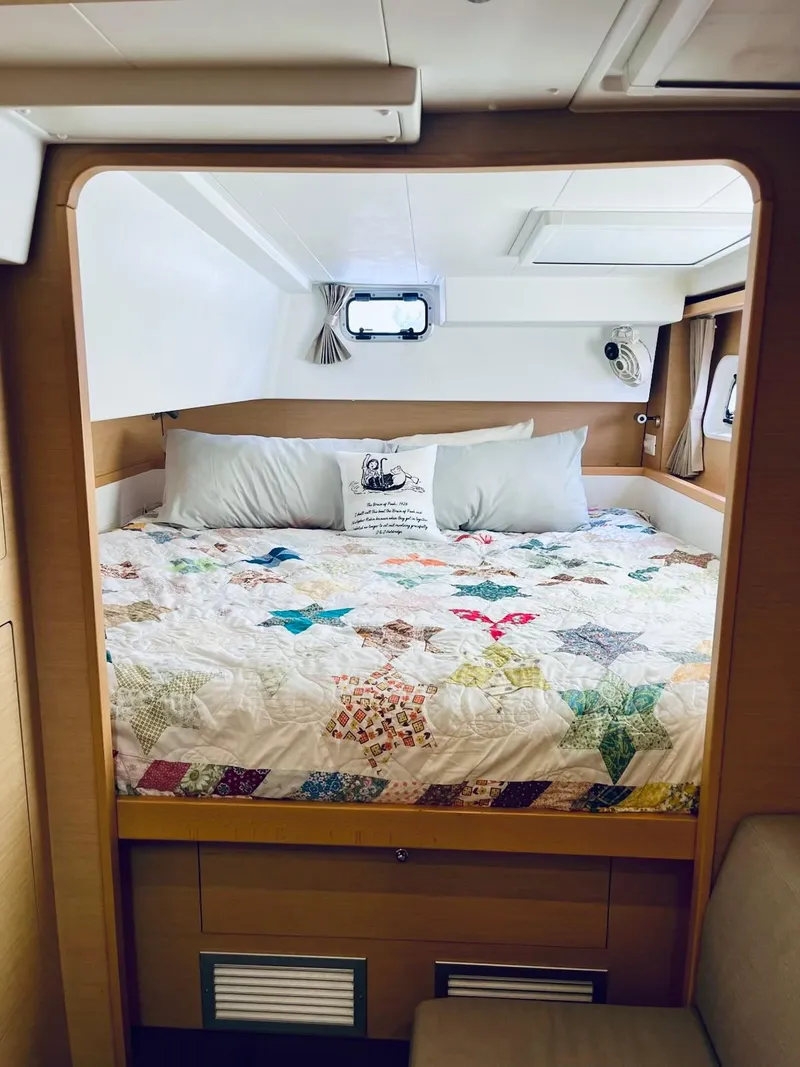 Slide: The Image of Cozy bedroom in 2017 Lagoon 39 catamaran with colorful quilt and modern design. - 36